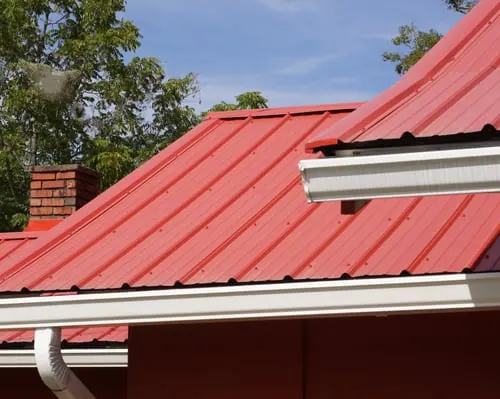 New metal roof and seamless gutter installed by Smart Roof Contracting